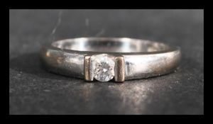 A hallmarked 18ct white gold and diamond ring set with a single round cut diamond. Diamond approx