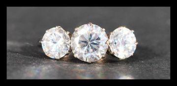 An 18ct white gold and platinum ring set with three large white stones.  Tests 18ct gold. Weight 3.