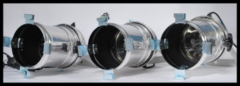 A set of three chromed Eurolite theatre / spot lights of usual form with fixing points / brackets to