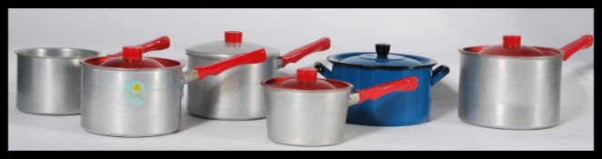 A group of vintage retro 20th century pots and pans dating from the 1950's to include a blue