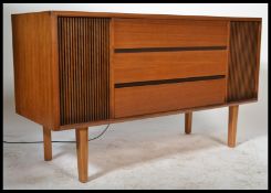 A 1970's mid century teak wood radiogram stereogram having hinged top opening to reveal record deck,