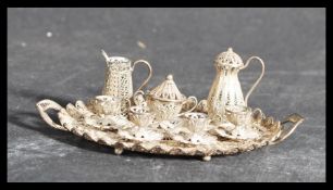 A 19th century Victorian silver filigree miniature dolls house tea service on twin handled gallery