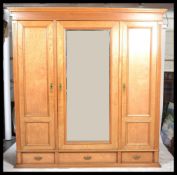 A Victorian 19th century triple wardrobe compactum