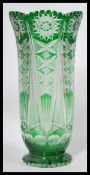 A large early 20th century Czech Bohemian cut glass vase of tall flared form having faceted