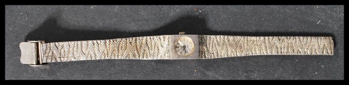 A vintage early 20th century Swiss Empress silver hallmarked watch having a silver bark effect