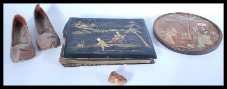 A collection of Chinese items dating from the 19th Century to include a pair of leather slippers,