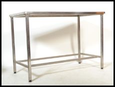A 20th century Industrial medical theatre table of stainless steel construction. The rectangular top