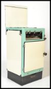 A vintage mid 20th Century two tone enamel gas coo