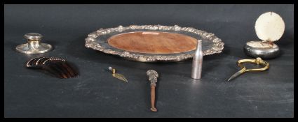 A collection of items to include a silver hallmarked lidded inkwell , faux tortoiseshell hair comb .