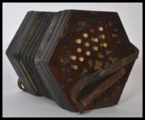 A 19th century Victorian rosewood squeeze box having a gilt tooled leather squeeze with bone buttons