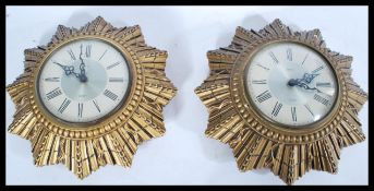 A pair of vintage mid 20th century retro Smiths sunburst wall clocks. The two tone dial having