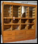 A large vintage 20th Century shop display haberdashery / shirt shop display cabinet, the upper