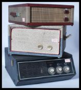 A collection of three vintage 20th Century four speed record players to include a Pilot, Ferguson,