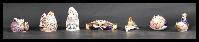 A collection of seven Royal Crown Derby imari paperweights to include crab , hen , squirrel , iron