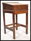 A vintage early 20th Century childs desk together with a 19th Century mirror fronted wall hanging