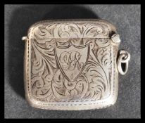 An early 20th century silver hallmarked vesta case by Joseph Gloster Ltd having a chased foliate