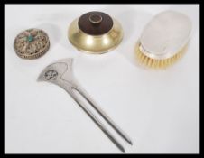 A mixed lot to include a silver hallmarked brush , filigree trinket pot , white metal hair piece ,