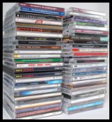 A collection of Compact Discs CD's featuring several artists and genres to include Dave Brubeck,