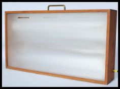 A retro 20th Century teak cased light box, hanging points / carry handle to the top with on and