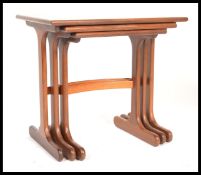 A retro 20th century nest of three E Gomme for G-Plan teak tables, the rectangular tops on