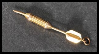 A yellow metal tests as 9ct gold pendant in the form of a dart. Weighs 4.6 grams