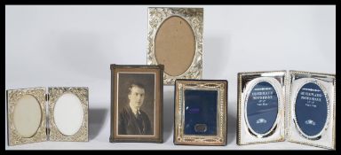 A collection of silver plated easel picture frames together with a silver sterling hallmarked