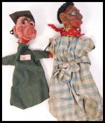 A pair of 1920's antique vintage paper mache handmade hand puppets, one in the form of a school