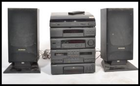 A retro 20th Century Pioneer musical stacking system, consisting of amplifier, tape decks, radio and
