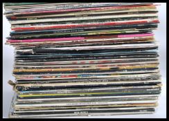 A collection of vinyl Long Play LP records featuring several artists and genres to include Human