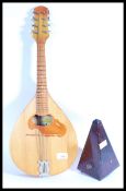 A 20th Century eight string Russian made Mandolin together with a vintage German ' System