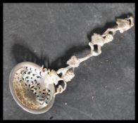 A mid 19th century Victorian silver hallmarked sugar sifter spoon with pierced bowl having an ornate