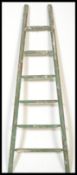 A vintage retro 20th century industrial hop / apple picking ladder of tapering form with painted
