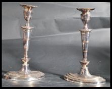 A pair of 20th century vintage silver plated candlesticks