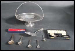 A group of silver hallmarked and sterling silver flatware along with a silver plated tazza