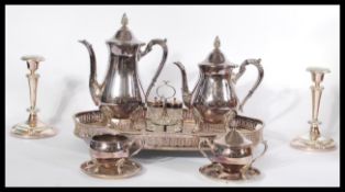 A Viners silver plated four piece tea service set along with a silver plated candlestick , cut glass