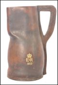 A vintage 20th century leather blackjack drinking