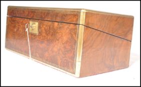 A 19th century walnut and brass bound writing slop
