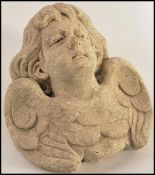 A 19th century Victorian carved stone wall mask pl