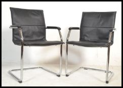 A set of 4 retro style chrome cantilever dining ch