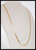 A hallmarked 9ct gold fancy link chain necklace having a lobster claw clasp. Import marks for
