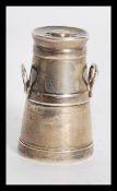 An early 20th century novelty silver hallmarked pepperette condiment in the form of a milk churn
