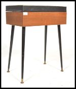 A vintage 20th century retro teak sewing box raise