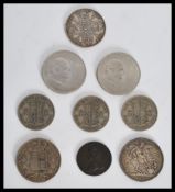 A group of silver coins dating from the 19th century to include a Victorian Crown 1897 , 1889 coin ,