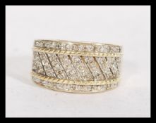 A hallmarked 9ct gold and diamond lattice band ring. Hallmarked London. Weight 5.2g. Size M.
