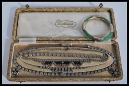 A vintage 20th century Art Deco white rhinestone and blue sapphire type rhinestone demi-parure