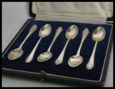 A set of six early 20th century silver hallmarked coffee tea spoons complete in fitted cutlery case.