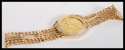 A full sovereign bracelet having a 1968 sovereign coin set in a 9ct gold bracelet chain with heart