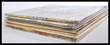 A collection of long play LP vinyl records featuri