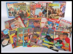 A collection of vintage children's albums and maga