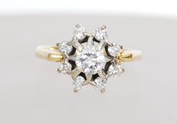 An 18ct gold and diamond cluster ring having a lar